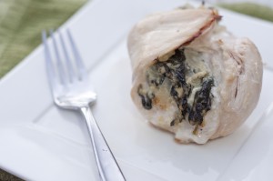 This photo depicts a delicious Spinach and Feta Stuffed Chicken Breast.