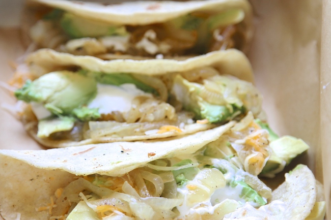 sweet onions and avocado tacos up close