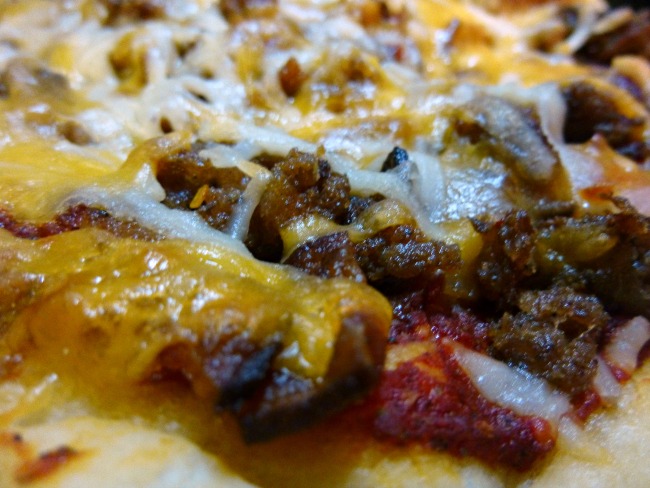 FB Taste Ark Mar Pork Lovers Skillet pizza closeup